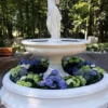 Casa Padrino Barock Garten Deko Springbrunnen Frau mit Krug Weiß Ø 240 x H. 235 cm - Prunkvoller Gartenbrunnen im Barockstil - Stein Brunnen mit Umrandung - Barock Garten Deko Accessoires