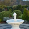 Casa Padrino Barock Springbrunnen Weiß Ø 120 x H. 129 cm - Prunkvoller Gartenbrunnen im Barockstil - Runder Gartendeko Stein Brunnen - Barock Garten Deko Accessoires