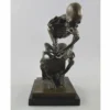 Casa Padrino Bronze Deko Skulptur Skelett Bronze / Schwarz H. 25 cm - Deko Accessoires