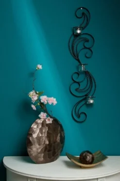 Casa Padrino Designer Wandteelichthalter Schwarz 16 x 9 x H. 74 cm - Metall Wanddeko mit Teelichthaltern aus Glas