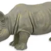 Casa Padrino Kunstharz Deko Skulptur Nashorn Grau / Gold 77 x 25,2 x H. 36 cm - Dekofigur - Tierfigur - Wohnzimmer Deko