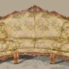 Casa Padrino Luxus Barock Sofa Beige / Mehrfarbig / Braun - Gebogenes Wohnzimmer Sofa mit elegantem Blumenmuster - Barock Wohnzimmer & Hotel Möbel - Luxus Qualität - Made in Italy