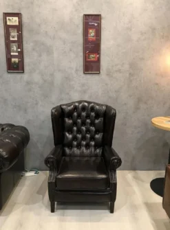 Casa Padrino Luxus Chesterfield Leder Ohrensessel Schwarz - Chesterfield Echtleder Wohnzimmer Sessel - Wohnzimmer Möbel - Chesterfield Möbel - Echtleder Möbel - Luxus Möbel - Luxus Einrichtung
