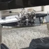 Casa Padrino Luxus Couchtisch mit Kunstmarmor Tischplatte Schwarz / Silber 140 cm - Luxus Möbel