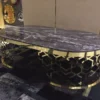 Casa Padrino Luxus Couchtisch mit Kunstmarmor Tischplatte Grau-Schwarz / Gold 140 cm