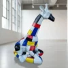 Casa Padrino Luxus Deko Skulptur Giraffe Sitzend Mondrian H. 80 cm - Deko Skulptur - Deko Figur - Tierfigur - Gartendeko