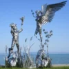 Casa Padrino Luxus Deko Skulptur Engel und Pan Silber 325 x 173 x H. 370 cm - Riesige Edelstahl Skulptur - Riesige Garten Deko Figur - Garten Skulpturen - Metall Skulpturen