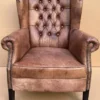 Casa Padrino Luxus Echtleder Chesterfield Ohrensessel Vintage Braun / Schwarz Wohnzimmer Sessel Leder