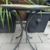 Casa Padrino Luxus Jugendstil Gartentisch Mehrfarbig / Grau Ø 70 cm - Schmiedeeisen Garten Tisch mit Lavastein Tischplatte - Barock & Jugendstil Garten Möbel - Luxus Qualität - Made in Italy