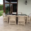 Casa Padrino Luxus Rattan Gartenmöbel Set Naturfarben - 1 Rattan Garten Esstisch mit Glasplatte & 6 Rattan Gartenstühle mit Armlehnen - Moderne Luxus Rattan Garten & Terrassen Möbel