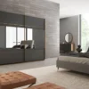 Casa Padrino Luxus Schlafzimmerschrank Braun / Grau / Messingfarben 254 x 68 x H. 230 cm - Edler Massivholz Kleiderschrank mit 2 verspiegelten Schiebetüren - Luxus Schlafzimmer Möbel