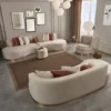 Casa Padrino Luxus Sofa Creme / Gold 270 x 120 x H. 76 cm - Gebogenes Wohnzimmer Sofa - Hotel Sofa - Wohnzimmer Möbel - Hotel Möbel - Luxus Möbel - Luxus Einrichtung - Wohnzimmer Einrichtung