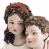 Casa Padrino Porzellan Deko Puppen Skulptur Junge & Mädchen H. 22,5 cm - Made in Italy